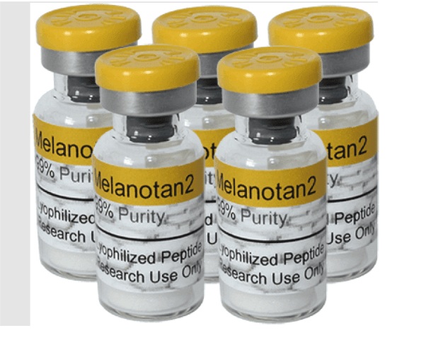 Five small vials with yellow caps and printed labels