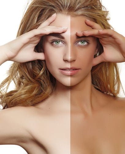 Portrait split between lighter and tanned skin tones